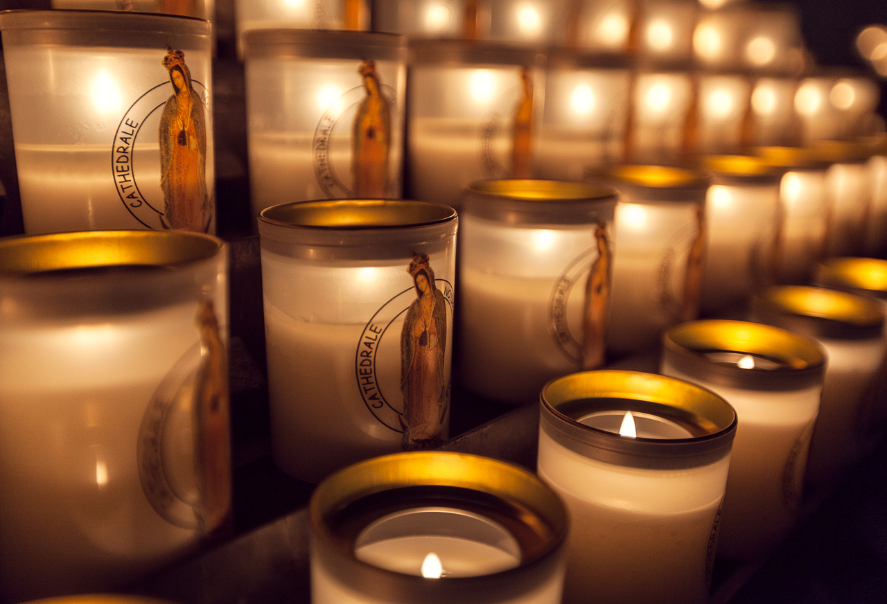 Lit Candles in Notre Dame Cathedrale Paris Battered LuggageBattered